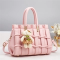 Detailed view of pink woven leather texture with a cute plush bear pendant accessory - 28*14*18CM / Light Pink