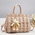 Close-up of beige lychee leather handbag with woven texture and gold hardware detail - 28*14*18CM / Light Khaki