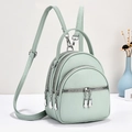 Mint green textured leather backpack with multiple zip compartments and adjustable straps - Green