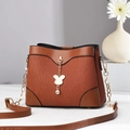 Caramel brown wavy textured shoulder bag with gold chain and diamond pendant - Brown