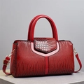 Polished red crocodile pattern handbag with sturdy handles and golden metal buckles - Red