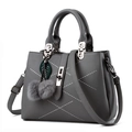 Gray lychee grain PU leather handbag with white stitching and decorative fur ball charm - 29x13x21cm / Gray