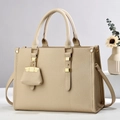 Elegant apricot lychee grain leather tote bag with gold hardware and mini charm - Khaki