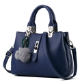 Deep blue leather shoulder bag with V-shaped stitching and grey pompom keychain - 29x13x21cm / Royal Blue