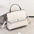 Elegant beige crossbody bag with top handle and silver buckle in minimalist studio setting - 24*11*20CM / Off-white