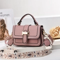 Dusty rose handbag with elegant gold hardware and decorative floral embroidery strap - Pink