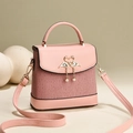 Pink pleated handbag for women with swan heart buckle and pearl fringe detail - Pink