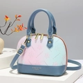 Blue and pink gradient crossbody bag with floral pattern on a white display stand - Blue