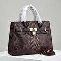 Elegant deep red snakeskin embossed leather handbag with gold hardware and shoulder strap - Coffee