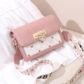 Pink and beige crossbody bag with golden heart clasp and stylish patterned strap - Pink