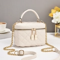 Chic quilted beige leather crossbody bag with gold zippers and chain strap in daily scene - Off-white