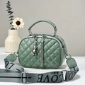 Green quilted handbag with double zippers, bear charm, and LOVE print shoulder strap - Green
