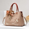 Beige floral embroidered handbag with silk scarf and pearl leaf charm on white display - Single Bag / Khaki