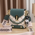 Quilted crossbody bag in green and white with gold chain and bear charm detail - Green