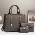Detailed set of three taupe leather tote bags with a golden clasp and a long strap - Handbag, Clutch And Card Holder / Khaki