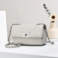 Elegant quilted crossbody bag with silver chain strap on a white minimalist stage - Gray