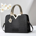 Elegant black crocodile-textured tote bag with gold V-metal trim and woven handles - Glossy Black