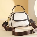 Quilted beige bucket bag with brown trim and wide logo strap in a minimalist setting - Off White