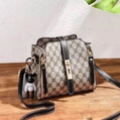 Crossbody bucket bag with classic monogram pattern and cool black character pendant - GD With Coffee