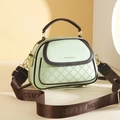 Mint green crossbody bucket bag with quilted patterns and wide brown woven strap - Apple Green