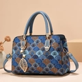 Fashionable shell-patterned top handle bag for women with blue leather strap and pearl charm - Colorful Floral / Blue