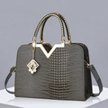 Dark gray crocodile pattern handbag with gold V-shape buckle and woven top handles - Glossy Grey