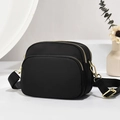Minimalist black nylon crossbody bag with multi-layer zippers and gold metal hardware - Black/Solid Color