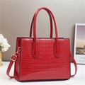 Elegant red crocodile embossed patent leather tote bag with top handles and gold hardware - Red