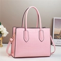 Pink faux leather handbag with crocodile pattern, top handle and golden hardware - Pink