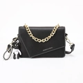 Black leather crossbody bag with white stitching and gold chain strap on white background - Black