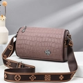 Brown crocodile texture barrel bag with wide floral patterned strap on display - Dusty Pink