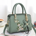 Morandi green leather handbag with floral embroidery and butterfly charm accessory - Light Green