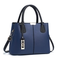 Navy blue and black contrast handbag with pebbled leather and gold metal accents - Blue and Black