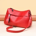 Elegant red pebbled leather shoulder bag with silver hardware and adjustable strap - Red