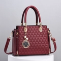 Elegant wine red geometric embossed handbag with pearl clover charm and shoulder strap - Red