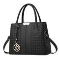 Elegante schwarze Handtasche aus Narbenleder mit Webstruktur und Herz-Blumen-Anhänger - Schwarz
