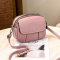 Pink faux leather crossbody bag with multiple zippers and adjustable shoulder strap - Dusty Pink
