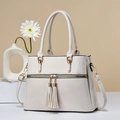 Creamy white pebbled leather tote bag with gold hardware and long tassel zippers - White