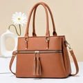 Brown litchi grain leather tote bag with tassels and detachable shoulder strap - Earthy Yellow