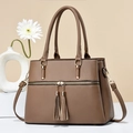 Brown litchi grain leather tote bag featuring stylish double tassels and golden hardware - Khaki