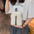 White pebbled leather mini crossbody phone bag with brown trim and gold zippers - White