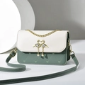 Elegant green and cream crossbody bag featuring heart quilting and swan heart lock - Green