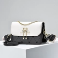 Contrast heart-quilted crossbody bag with gold swan buckle and wide jacquard strap - Black