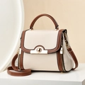 Bolso de mano bicolor crema con acabados dorados y textura de cuero granulado - Blanco Roto