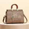 Brown leather handbag with monogram pattern, wooden handles and gold cat charm - Brown Monogram