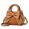 Brown faux snakeskin handbag with large bow ornament and top handle for women - Sequin Earthy Yellow