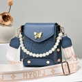 Minimalist navy blue square shoulder bag with woven texture, butterfly clasp and pearl strap - Blue