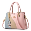Three-color contrast soft leather handbag in pink and beige with a butterfly pendant - Pink