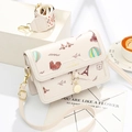 Beige crossbody square bag with travel pattern and dual interchangeable straps - White