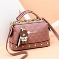 Pink quilted leather Boston handbag with metal studs and cute cartoon character charm - Pink